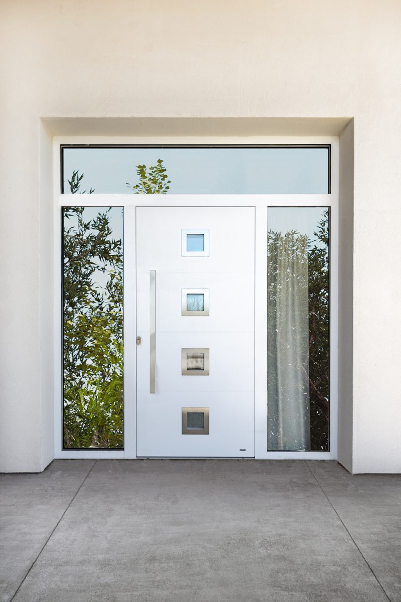 White front door with square glass inserts, side panels and a glazed top