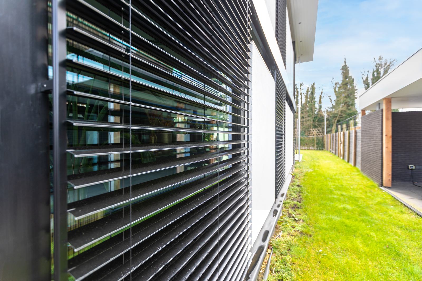 Slatted external blinds on a modern house